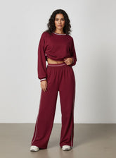 Vector Sportswear Lounge Strides pants featuring relaxed wide-leg fit, piping detail, and all-day comfort.