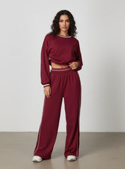 Vector Sportswear Lounge Strides pants featuring relaxed wide-leg fit, piping detail, and all-day comfort.
