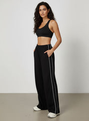 Vector Sportswear wide-leg lounge trousers with breathable fabric, elastic waistband, and versatile design.