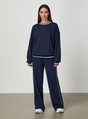 Vector Sportswear Lounge Strides wide-leg pants with elastic waist and piping detail for modern style.