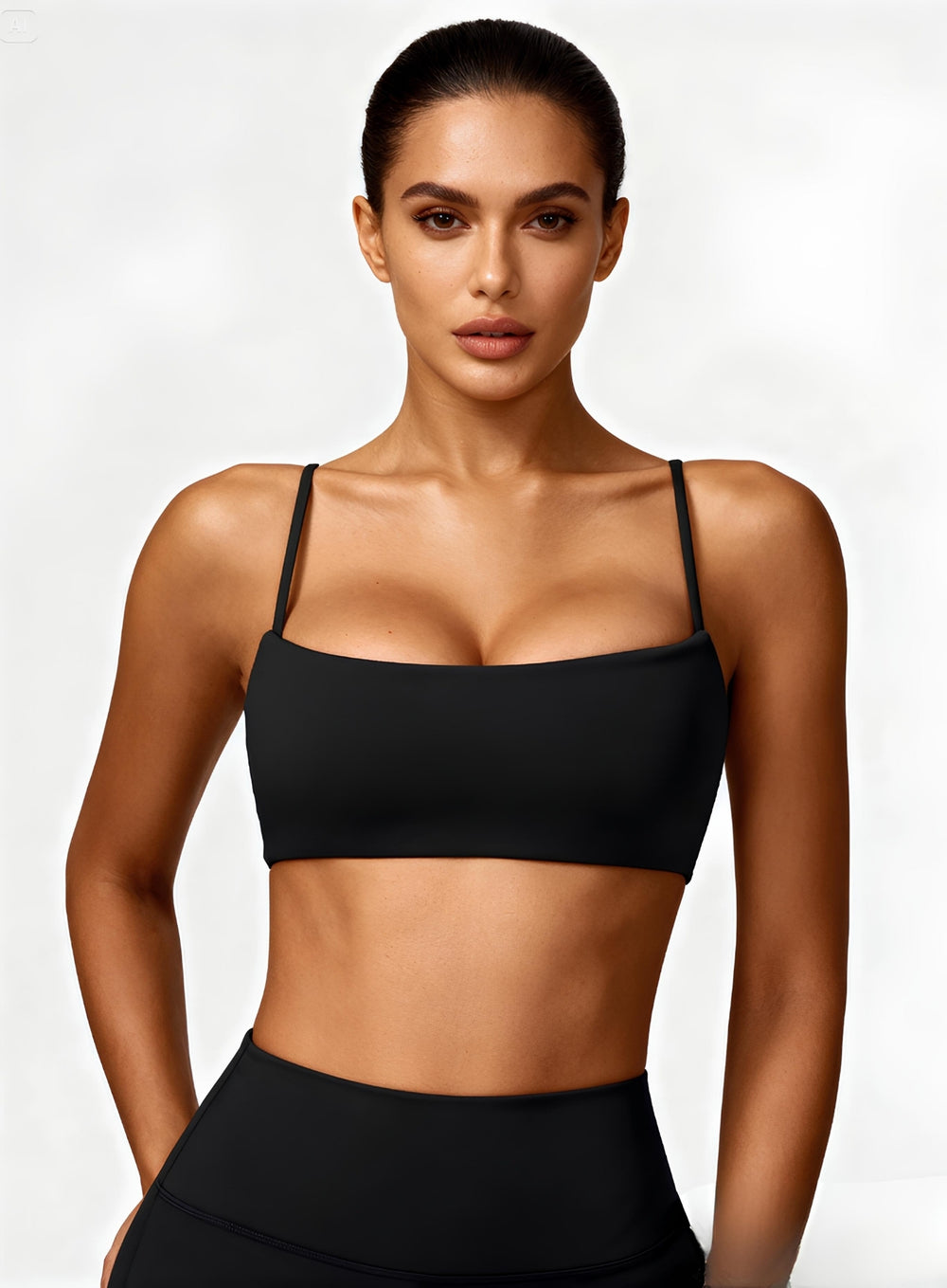 Woman wearing the CloudSense Seamless Sling Bra in black — open-back seamless sports bra with thin sling straps, sculpting fit, and smooth activewear fabric. | Vectorsportswear