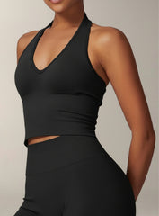 Vector Sportswear Essential Crop Top – Black, sleek V-neck activewear top designed for comfort, style, and movement.