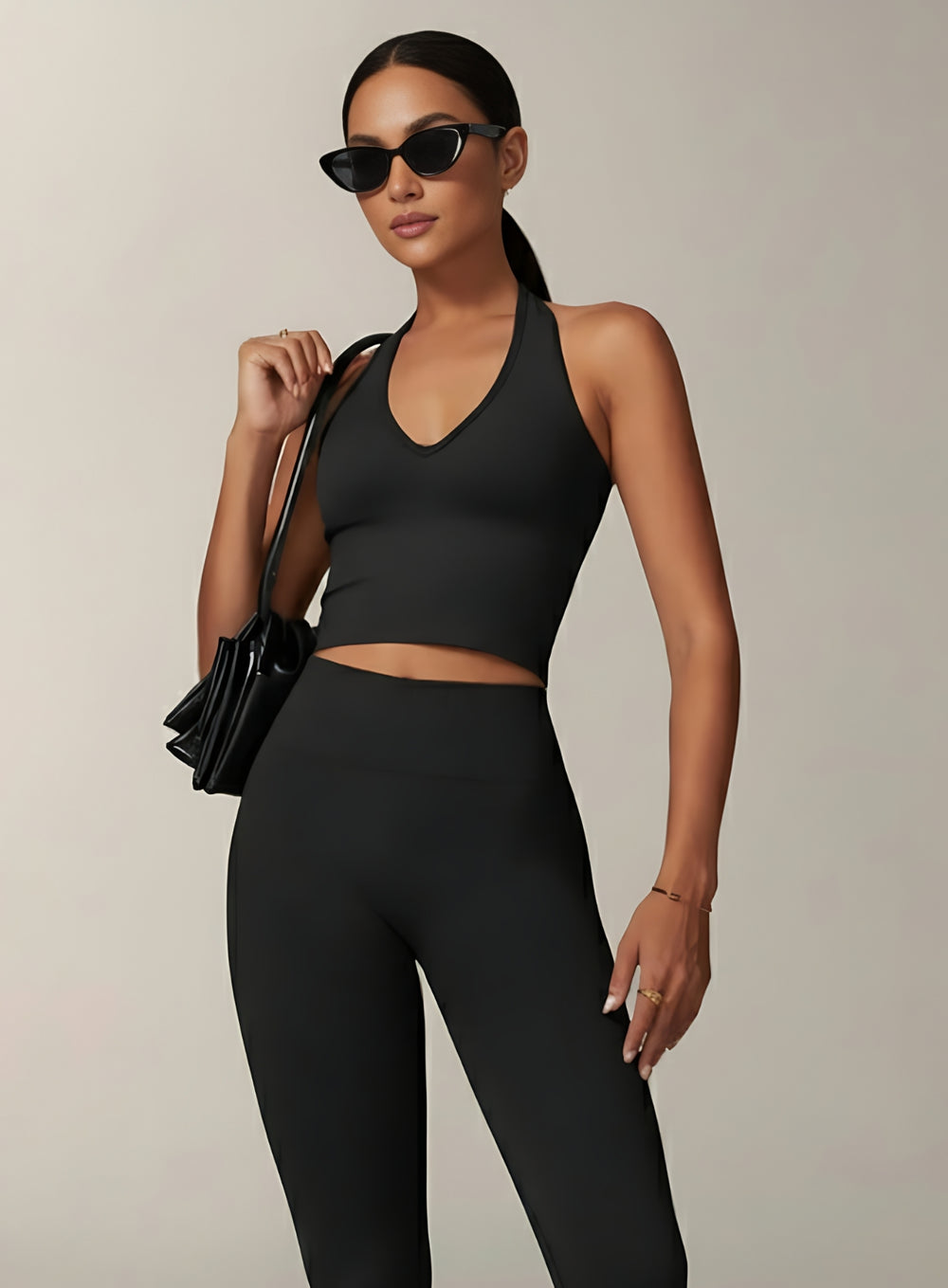 Vector Sportswear Essential Crop Top – Black, sleek V-neck activewear top designed for comfort, style, and movement.
