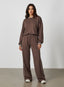 Vector Sportswear Lounge Strides wide-leg pants with elastic waist and piping detail for modern style.