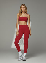Model wearing CloudSense Brushed Sports Bra in bright red with seamless fit and soft square neckline | Vectorsportswear