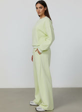 Vector Sportswear Lounge Strides wide-leg pants with elastic waist and piping detail for modern style.