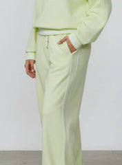 Vector Sportswear Lounge Strides wide-leg pants with elastic waist and piping detail for modern style.