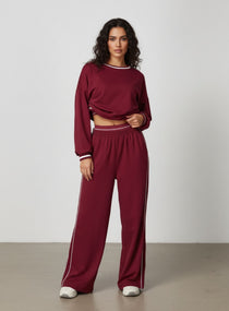 Vector Sportswear Lounge Strides pants featuring relaxed wide-leg fit, piping detail, and all-day comfort.