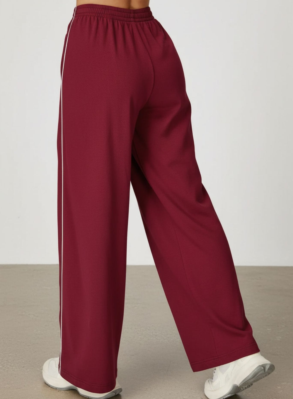 Vector Sportswear Lounge Strides pants featuring relaxed wide-leg fit, piping detail, and all-day comfort.