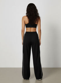 Vector Sportswear wide-leg lounge trousers with breathable fabric, elastic waistband, and versatile design.