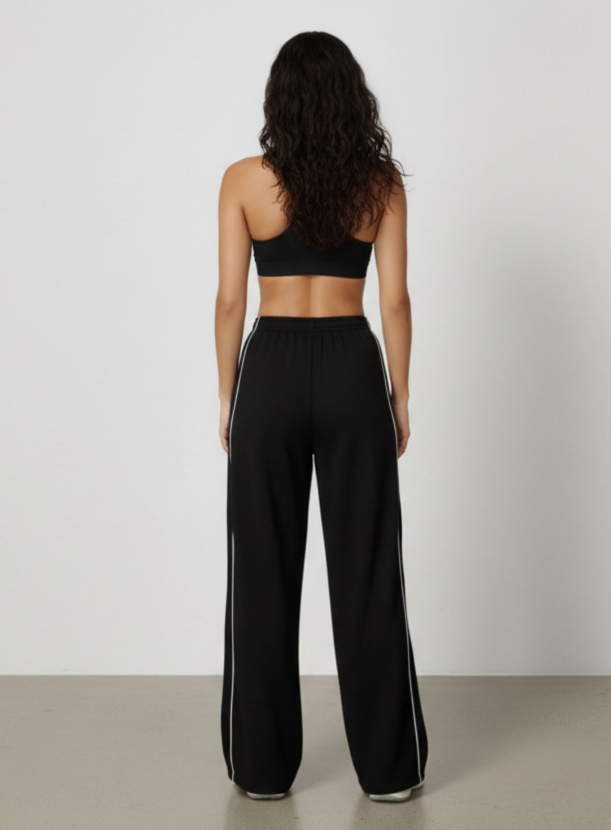Vector Sportswear wide-leg lounge trousers with breathable fabric, elastic waistband, and versatile design.