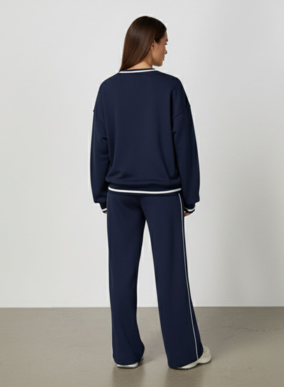 Vector Sportswear Lounge Strides wide-leg pants with elastic waist and piping detail for modern style.