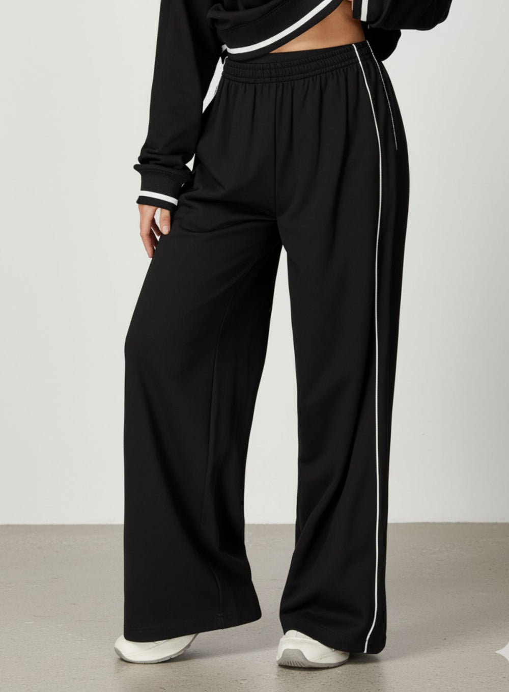 Vector Sportswear wide-leg lounge trousers with breathable fabric, elastic waistband, and versatile design.