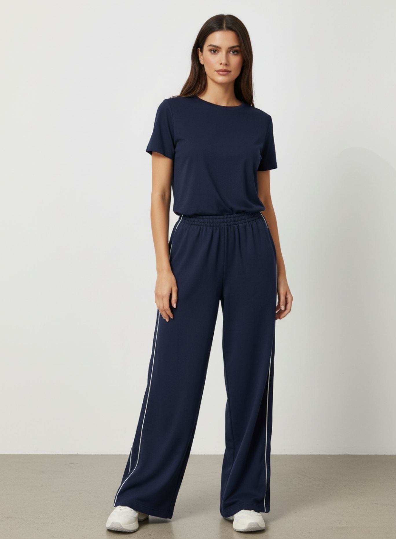 Vector Sportswear Lounge Strides wide-leg pants with elastic waist and piping detail for modern style.