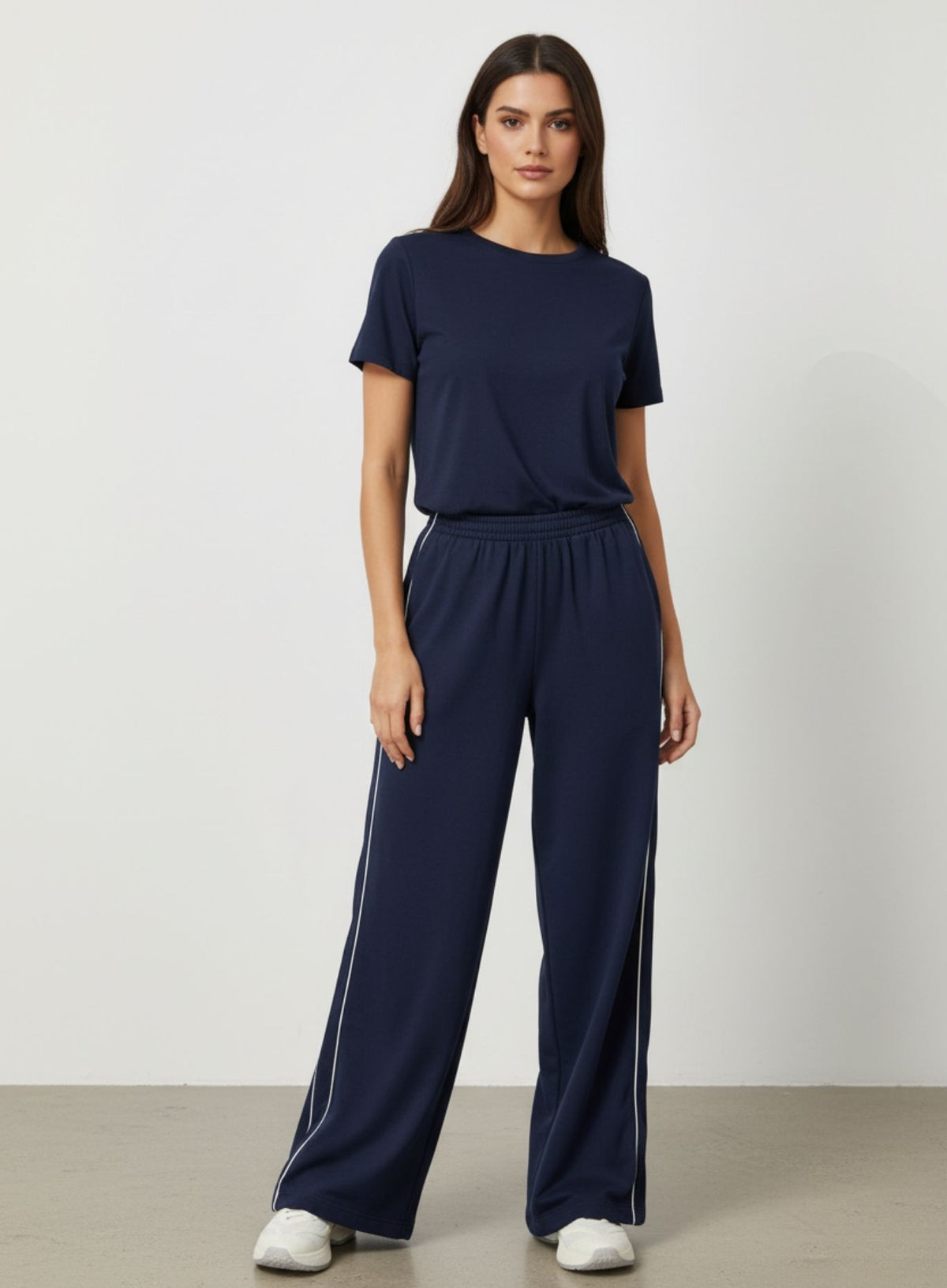 Vector Sportswear Lounge Strides wide-leg pants with elastic waist and piping detail for modern style.