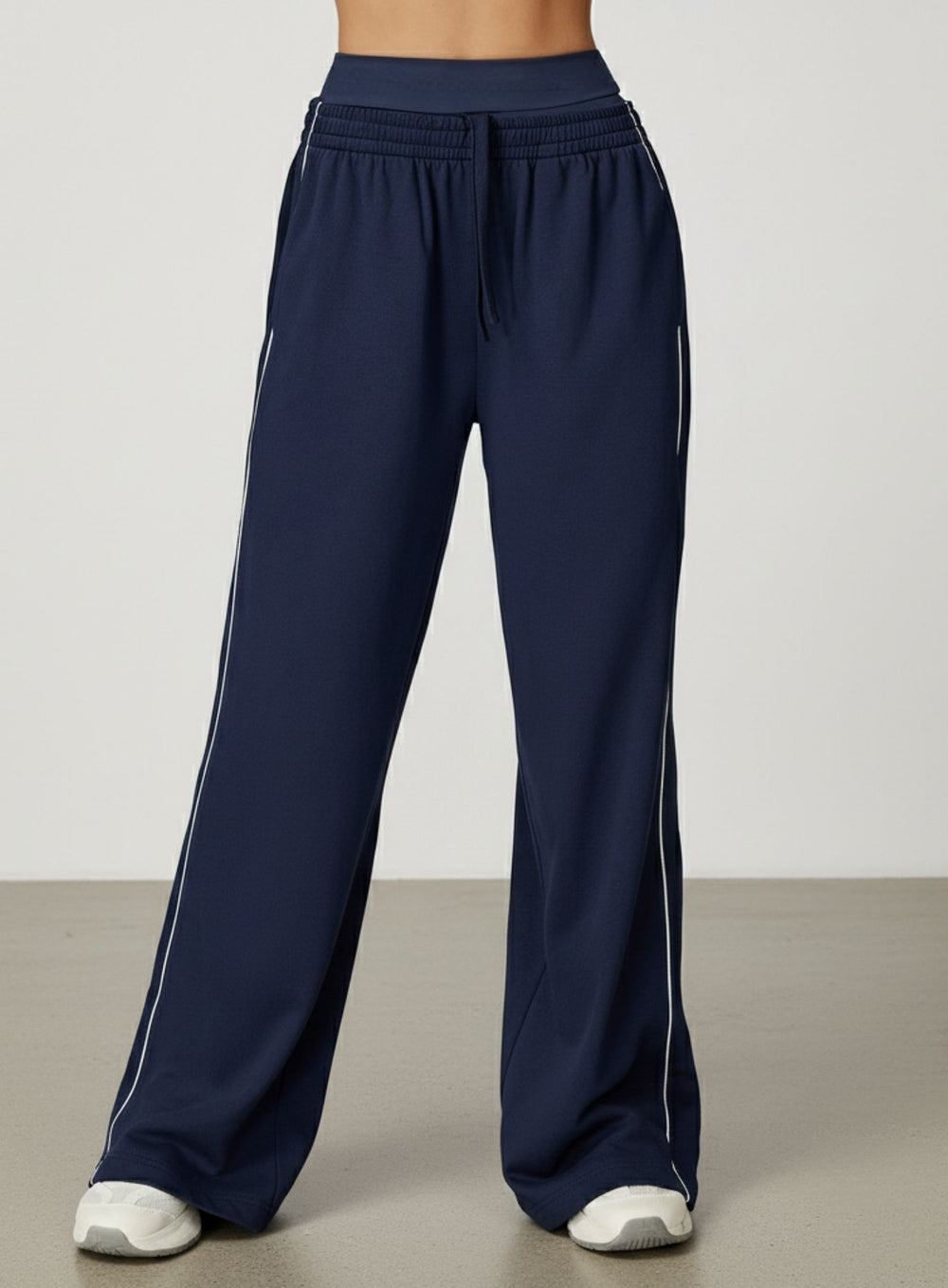 Vector Sportswear Lounge Strides wide-leg pants with elastic waist and piping detail for modern style.