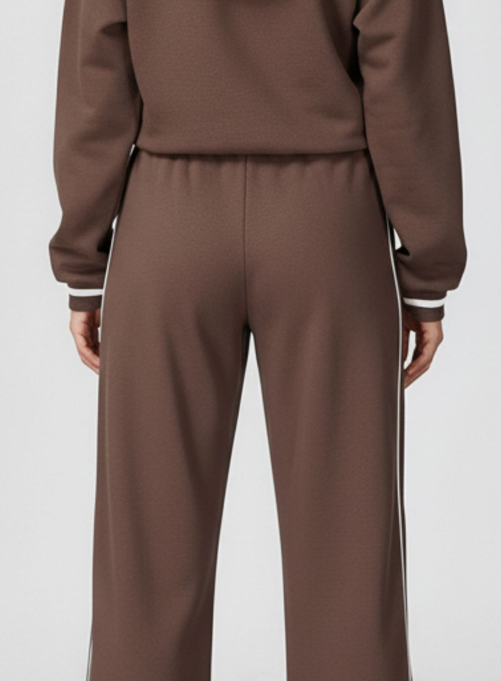 Vector Sportswear Lounge Strides wide-leg pants with elastic waist and piping detail for modern style.