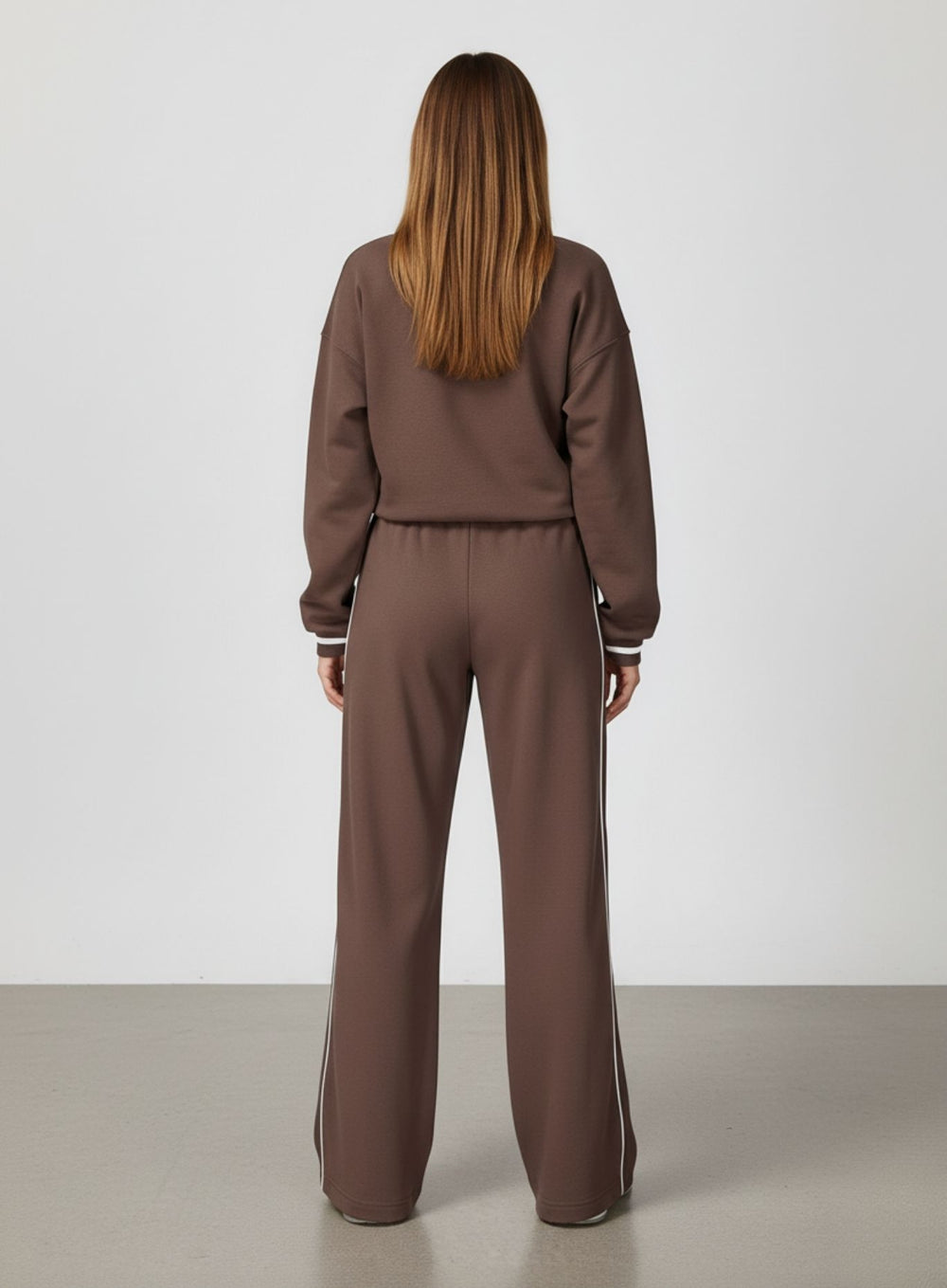 Vector Sportswear Lounge Strides wide-leg pants with elastic waist and piping detail for modern style.