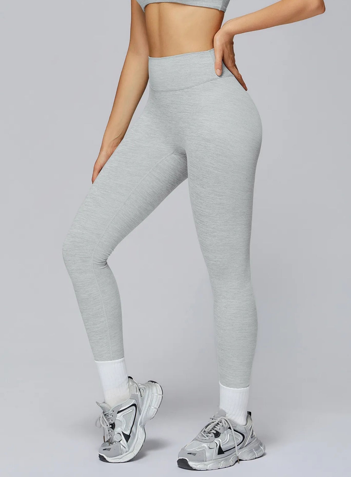 Athletic model in seamless brushed high-waist sculpt leggings, peach-lift and sweat-wicking | Vectorsportswear