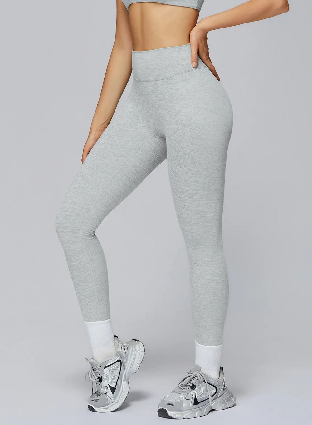 Athletic model in seamless brushed high-waist sculpt leggings, peach-lift and sweat-wicking | Vectorsportswear