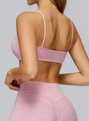 Rear angle showing seamless cherry pink CloudSense sports bra with supportive ribbed underband | Vectorsportswear