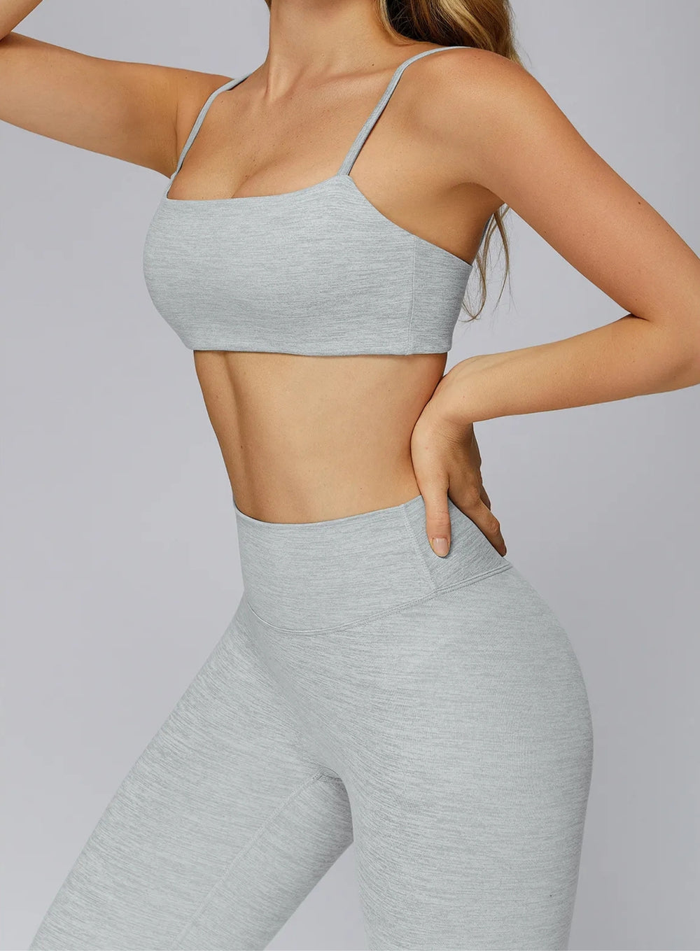 gray seamless CloudSense sports bra on model, square neckline and soft brushed fabric for gym and yoga | Vectorsportswear
