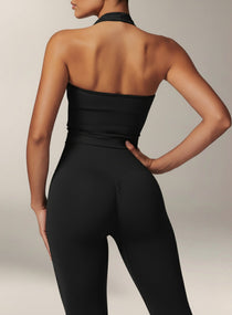 Vector Sportswear black halter crop top featuring open-back design, soft stretch fabric, and sculpting athletic fit.