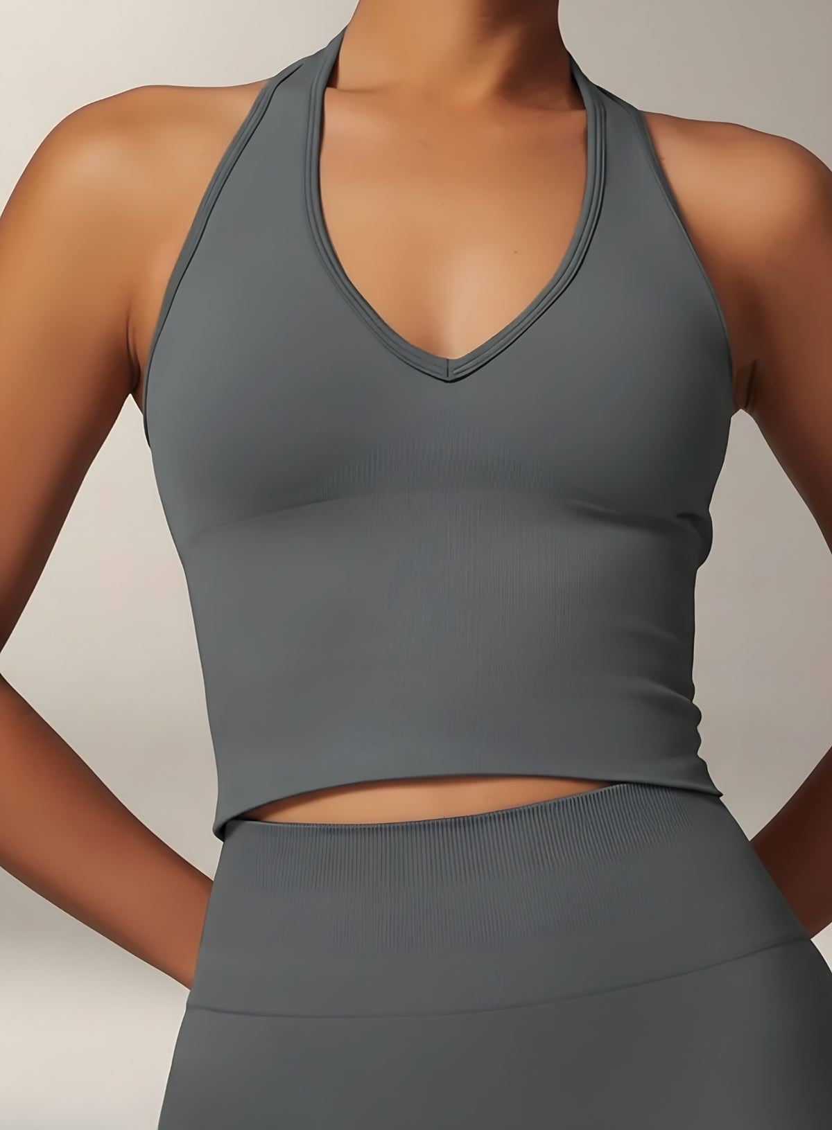 Vector Sportswear Essential Crop Top – Dark Gray, sleek V-neck activewear top designed for comfort, style, and movement.