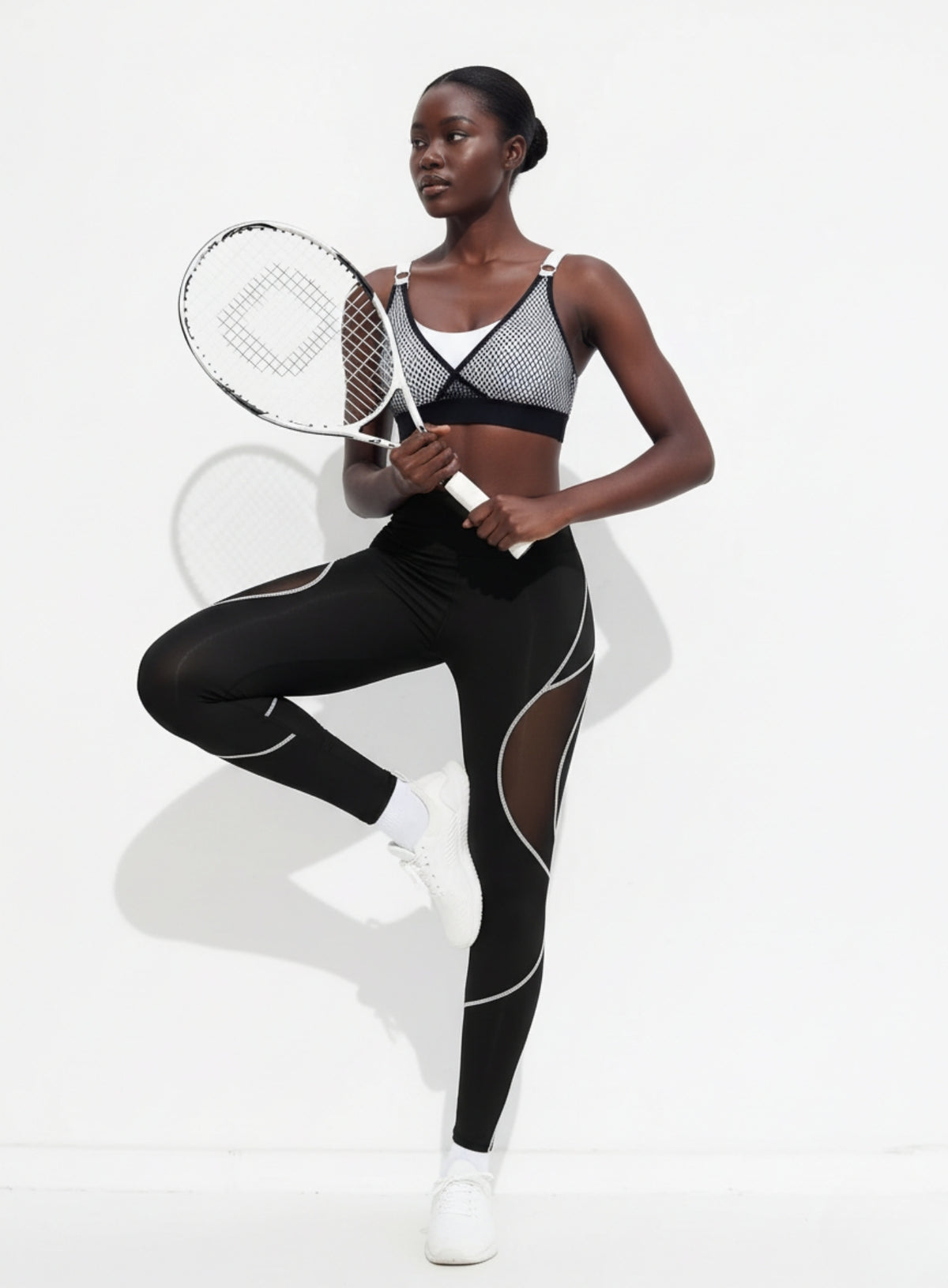 Women’s high-waisted black and white seamless leggings with lattice cutout detail- Vectorsportswear