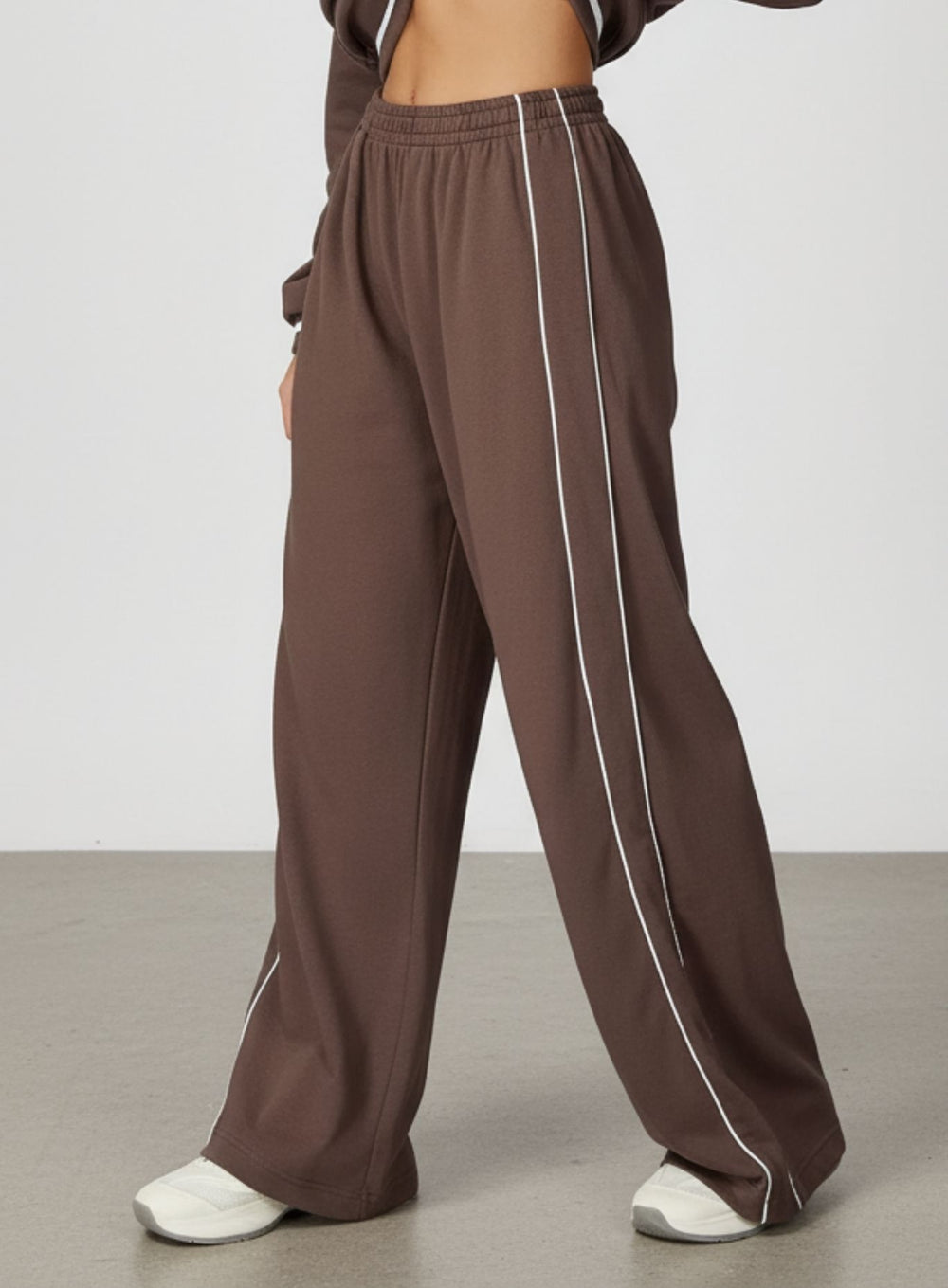 Vector Sportswear Lounge Strides wide-leg pants with elastic waist and piping detail for modern style.