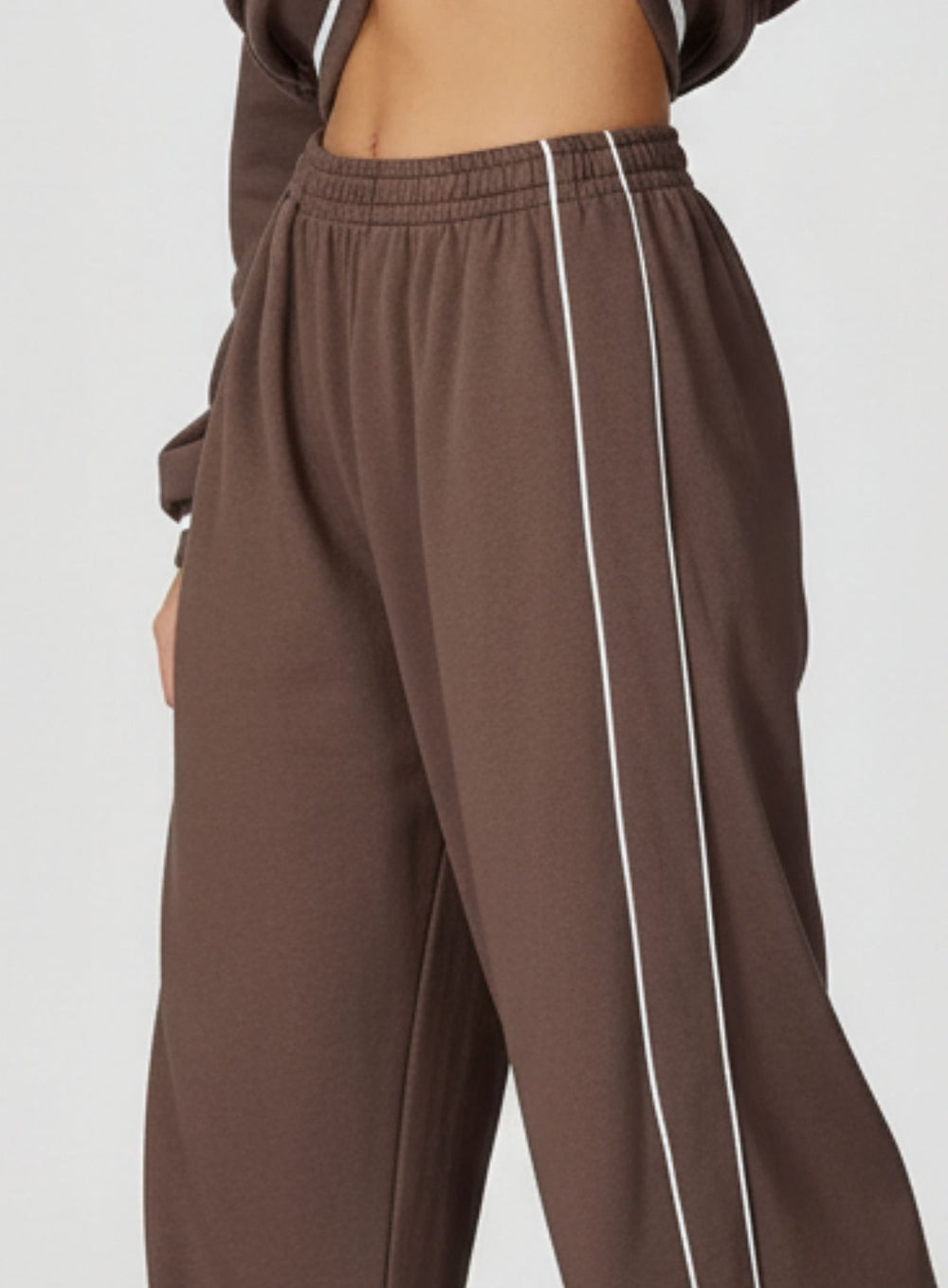 Vector Sportswear Lounge Strides wide-leg pants with elastic waist and piping detail for modern style.