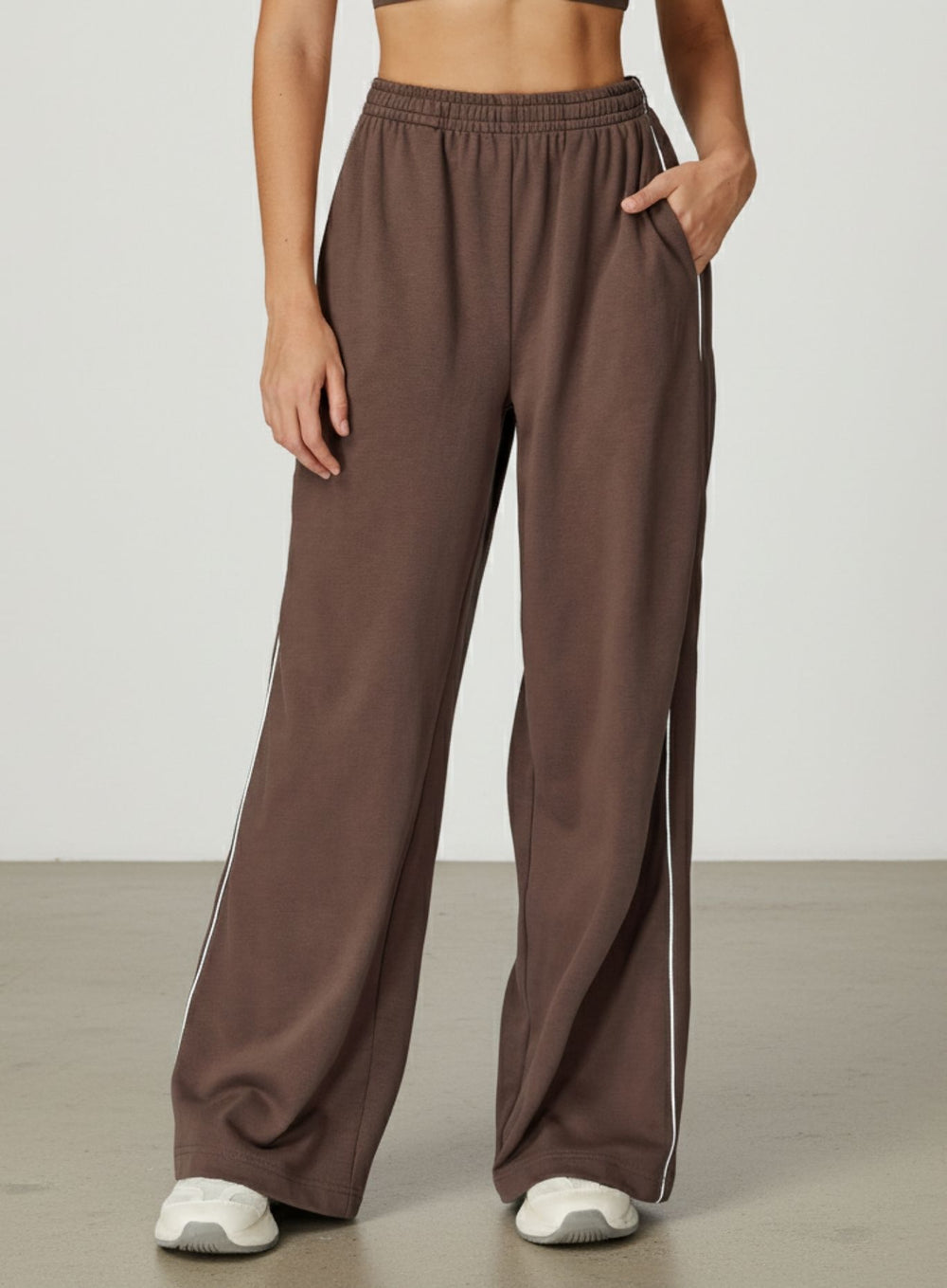 Vector Sportswear Lounge Strides wide-leg pants with elastic waist and piping detail for modern style.