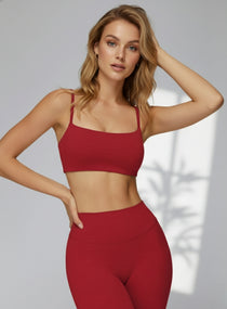 Model wearing CloudSense Brushed Sports Bra in bright red with seamless fit and soft square neckline | Vectorsportswear