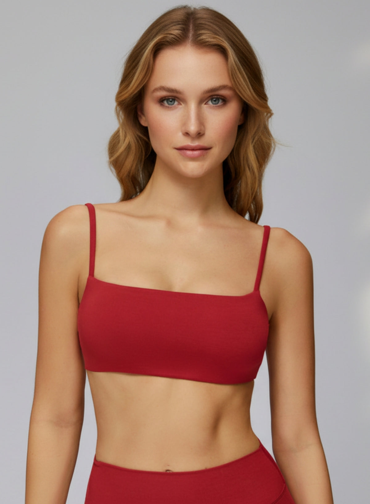 Red seamless CloudSense sports bra on model, square neckline and soft brushed fabric for gym and yoga | Vectorsportswear