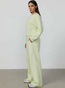 Vector Sportswear Lounge Strides wide-leg pants with elastic waist and piping detail for modern style.