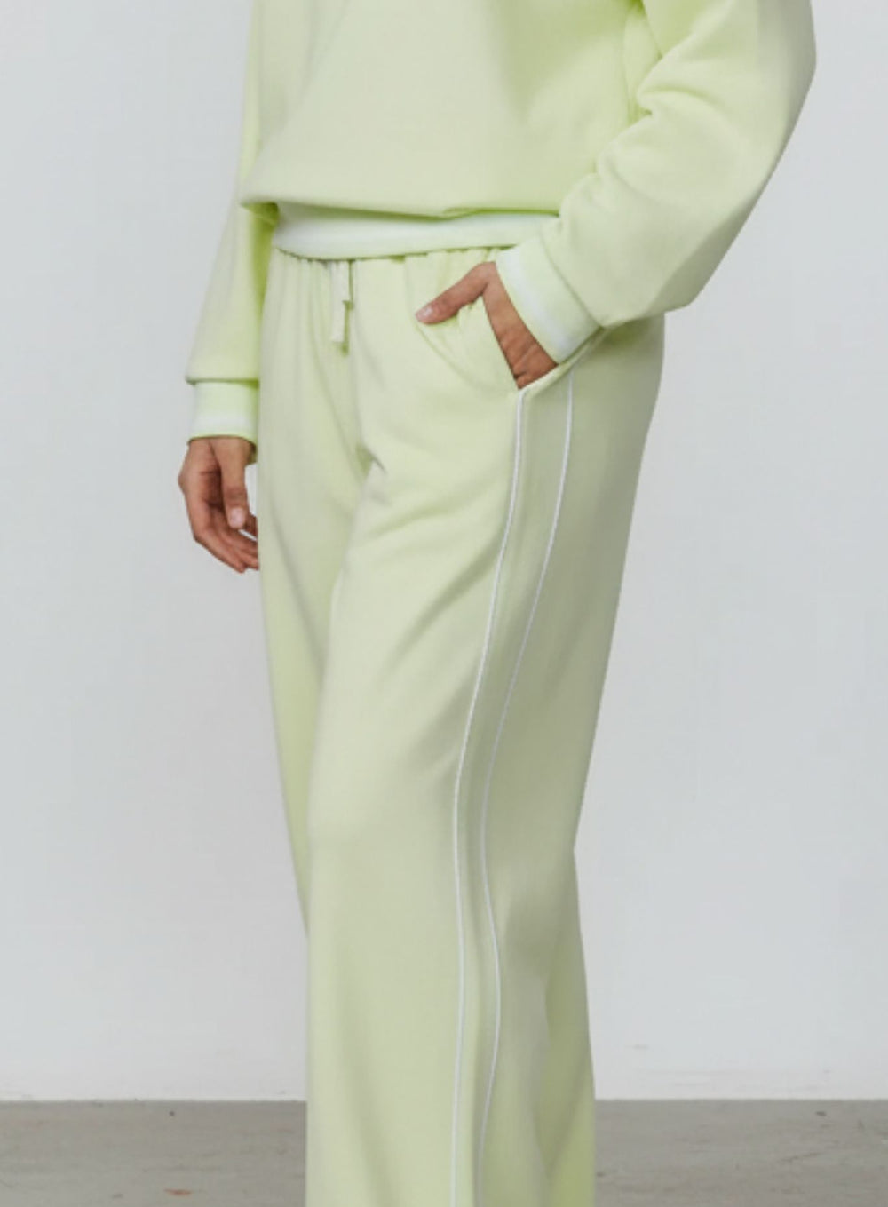 Vector Sportswear Lounge Strides wide-leg pants with elastic waist and piping detail for modern style.