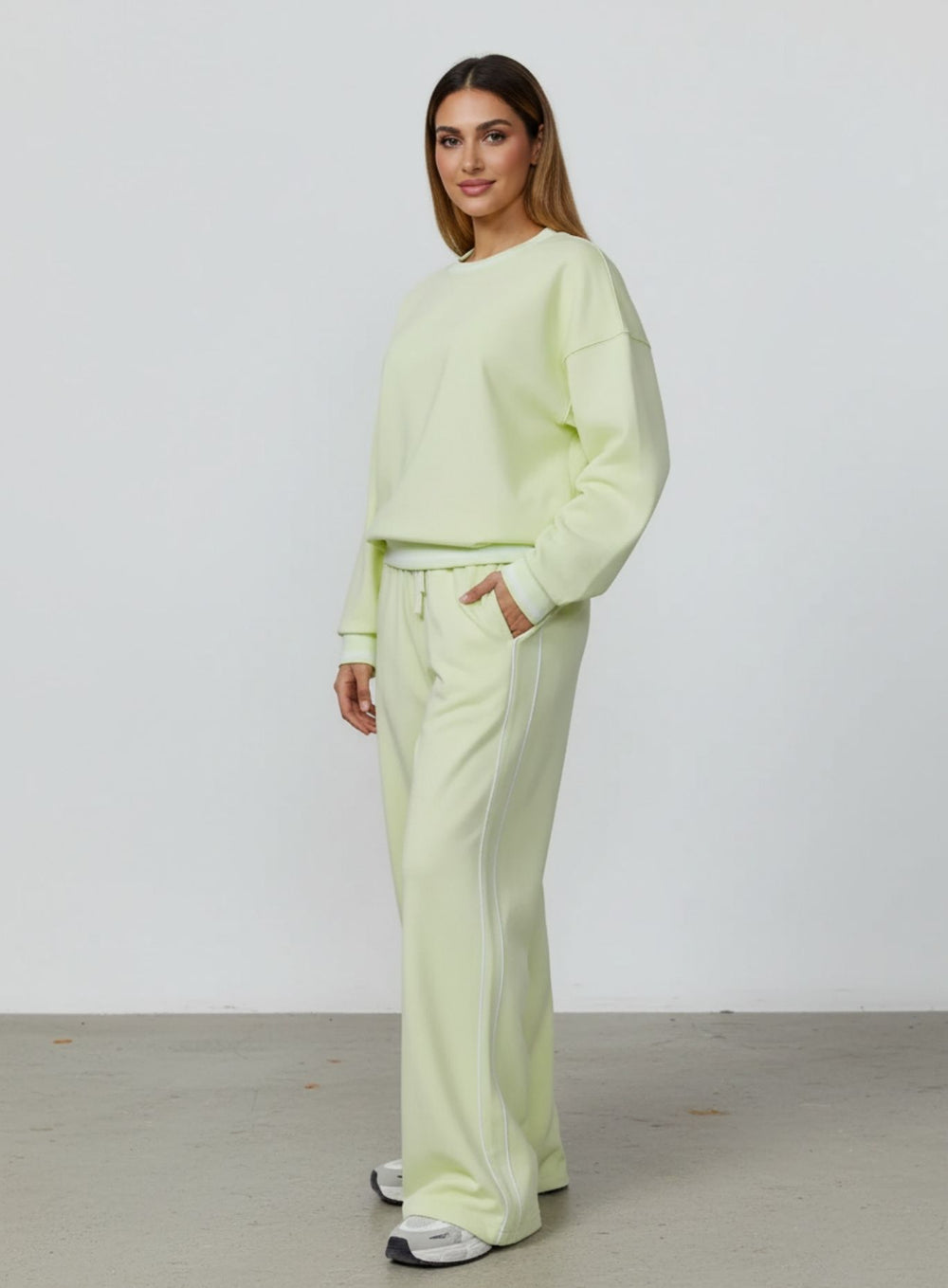 Vector Sportswear Lounge Strides wide-leg pants with elastic waist and piping detail for modern style.
