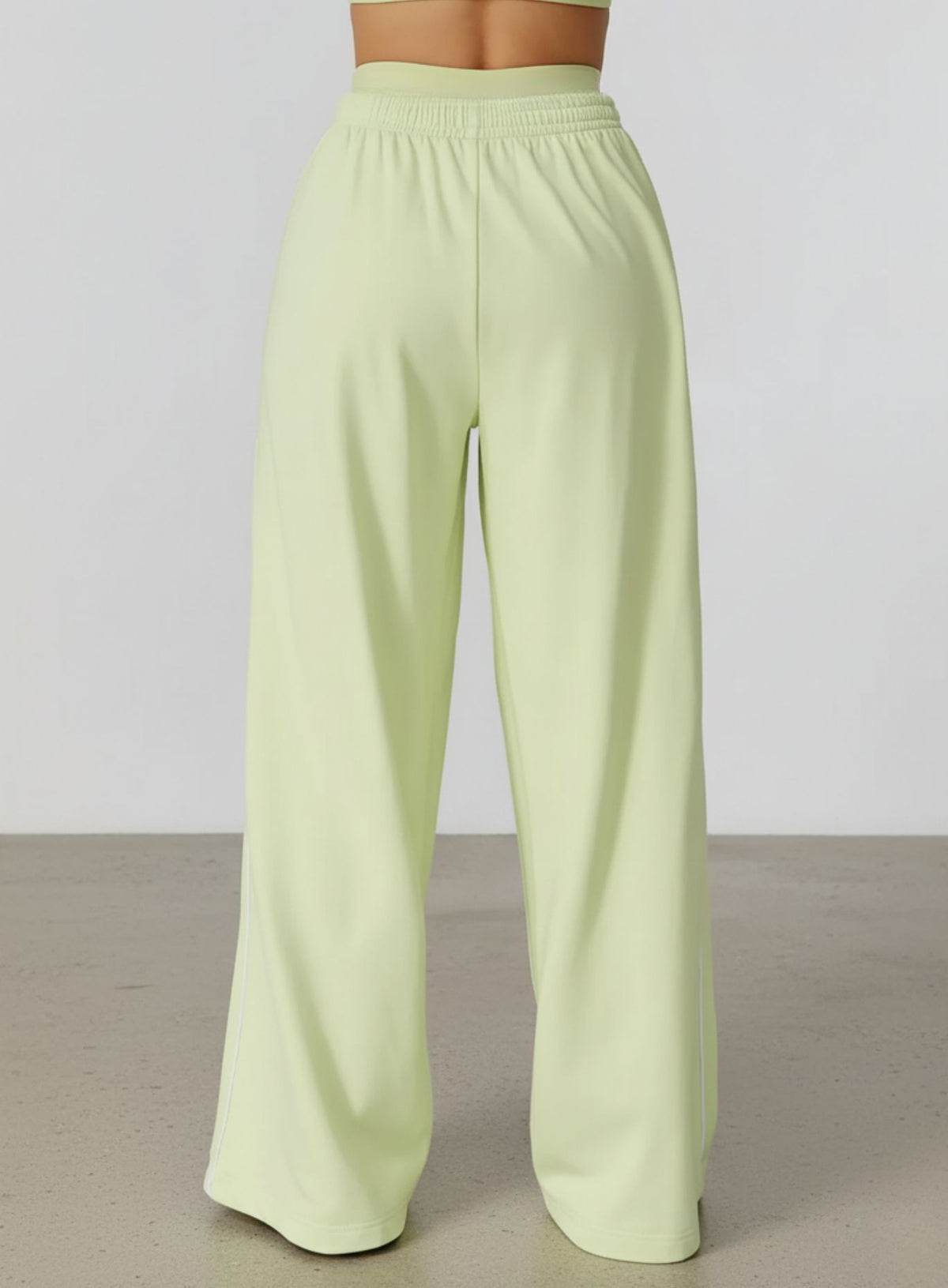 Vector Sportswear Lounge Strides wide-leg pants with elastic waist and piping detail for modern style.