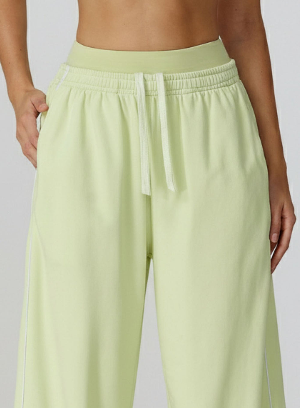 Vector Sportswear Lounge Strides wide-leg pants with elastic waist and piping detail for modern style.
