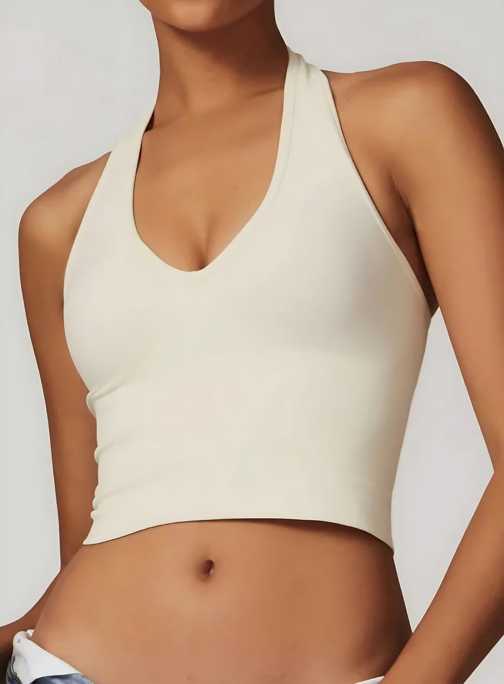 Vector Sportswear Essential Crop Top – Beige, sleek V-neck activewear top designed for comfort, style, and movement.