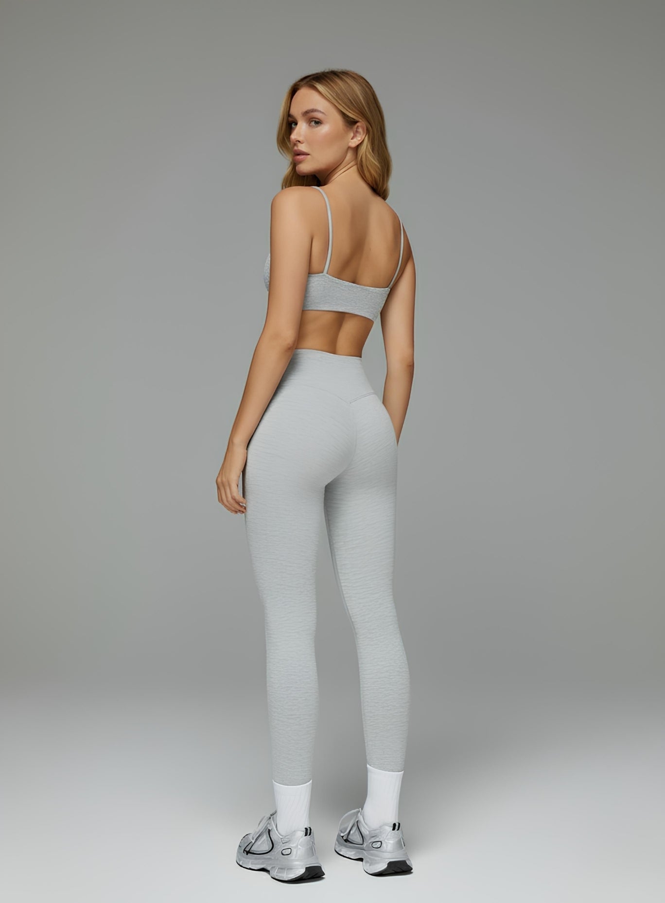 gray seamless CloudSense sports bra on model, square neckline and soft brushed fabric for gym and yoga | Vectorsportswear